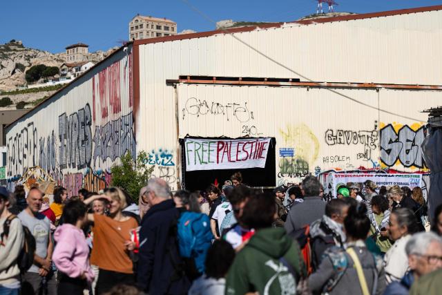 Activists gather in l'Estaque, part of Marseille's harbour, southern France, on April 4, 2026, during a rally in support of a flotilla carrying activists from “Thousand Madleens to Gaza” movement as they prepare to set sail. (Photo by CLEMENT MAHOUDEAU / AFP)