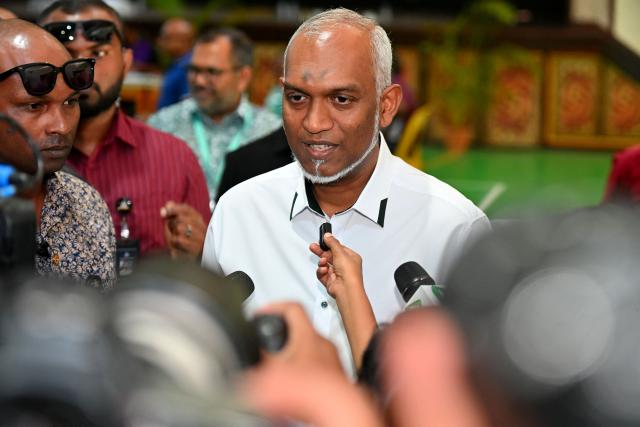 Maldives' President Mohamed Muizzu addresses the media at a polling station in Malé on April 4, 2026 as voting opens for the local council elections as well as a referendum on holding Presidential and Parliamentary elections on the same day.  (Photo by Mohamed Afrah / AFP)