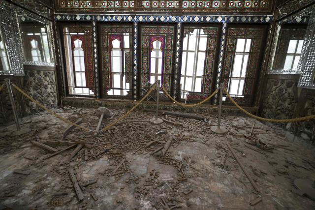 The damaged interiors of the historic Golestan Palace are pictured in Tehran on April 4, 2026. Since the start of the war, a senior Tehran cultural official said US and Israeli strikes have damaged at least 120 museums and cultural and historic sites nationwide, including the capital's UNESCO-listed Golestan Palace -- sometimes likened to Versailles. The palace complex is one of the oldest sites in the Iranian capital and once served as the residence of the Qajar dynasty. (Photo by ATTA KENARE / AFP) / 