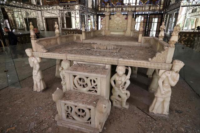 The damaged interiors of the historic Golestan Palace are pictured in Tehran on April 4, 2026. Since the start of the war, a senior Tehran cultural official said US and Israeli strikes have damaged at least 120 museums and cultural and historic sites nationwide, including the capital's UNESCO-listed Golestan Palace -- sometimes likened to Versailles. The palace complex is one of the oldest sites in the Iranian capital and once served as the residence of the Qajar dynasty. (Photo by ATTA KENARE / AFP) / 