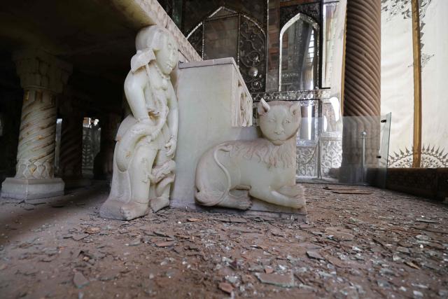 The damaged interiors of the historic Golestan Palace are pictured in Tehran on April 4, 2026. Since the start of the war, a senior Tehran cultural official said US and Israeli strikes have damaged at least 120 museums and cultural and historic sites nationwide, including the capital's UNESCO-listed Golestan Palace -- sometimes likened to Versailles. The palace complex is one of the oldest sites in the Iranian capital and once served as the residence of the Qajar dynasty. (Photo by ATTA KENARE / AFP) / 