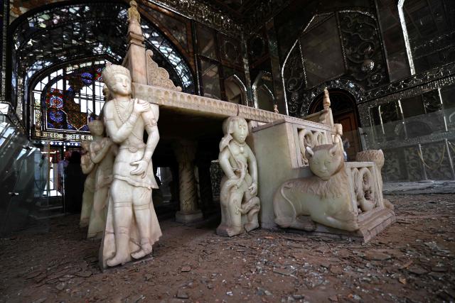 The damaged interiors of the historic Golestan Palace are pictured in Tehran on April 4, 2026. Since the start of the war, a senior Tehran cultural official said US and Israeli strikes have damaged at least 120 museums and cultural and historic sites nationwide, including the capital's UNESCO-listed Golestan Palace -- sometimes likened to Versailles. The palace complex is one of the oldest sites in the Iranian capital and once served as the residence of the Qajar dynasty. (Photo by ATTA KENARE / AFP) / 