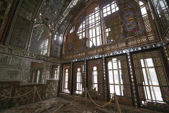 The damaged interiors of the historic Golestan Palace are pictured in Tehran on April 4, 2026. Since the start of the war, a senior Tehran cultural official said US and Israeli strikes have damaged at least 120 museums and cultural and historic sites nationwide, including the capital's UNESCO-listed Golestan Palace -- sometimes likened to Versailles. The palace complex is one of the oldest sites in the Iranian capital and once served as the residence of the Qajar dynasty. (Photo by ATTA KENARE / AFP) / 