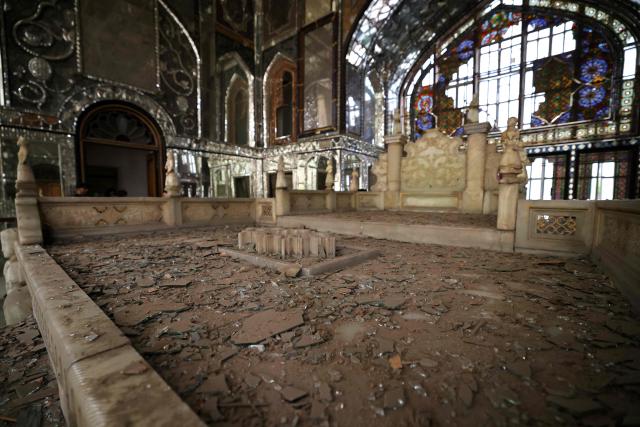 The damaged interiors of the historic Golestan Palace are pictured in Tehran on April 4, 2026. Since the start of the war, a senior Tehran cultural official said US and Israeli strikes have damaged at least 120 museums and cultural and historic sites nationwide, including the capital's UNESCO-listed Golestan Palace -- sometimes likened to Versailles. The palace complex is one of the oldest sites in the Iranian capital and once served as the residence of the Qajar dynasty. (Photo by ATTA KENARE / AFP) / 