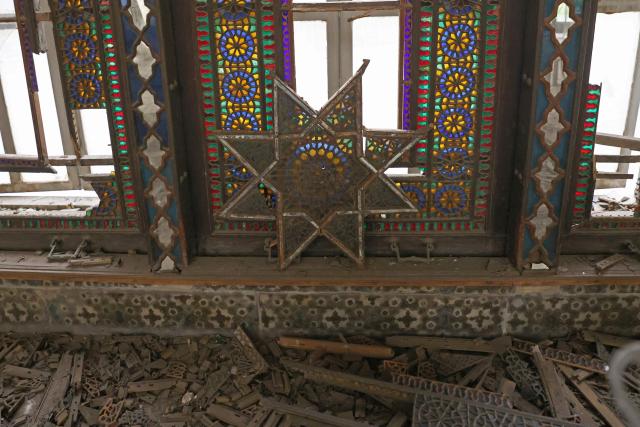 The damaged interiors of the historic Golestan Palace are pictured in Tehran on April 4, 2026. Since the start of the war, a senior Tehran cultural official said US and Israeli strikes have damaged at least 120 museums and cultural and historic sites nationwide, including the capital's UNESCO-listed Golestan Palace -- sometimes likened to Versailles. The palace complex is one of the oldest sites in the Iranian capital and once served as the residence of the Qajar dynasty. (Photo by ATTA KENARE / AFP) / 