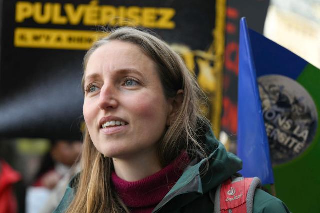 Josephine Dubois, member of Pollinis, an NGO aiming to preserve pollinators, takes part in the rally 'Marche Printemps Bruyant 2026', a mobilization against the use of pesticides, just a few days before World Health Day, in Paris on April 4, 2026. (Photo by Anna KURTH / AFP)
