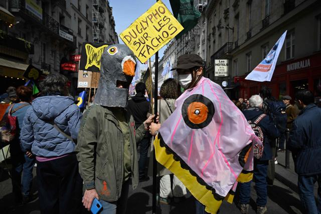 Demonstrators take part in the rally 'Marche Printemps Bruyant 2026', a mobilization against the use of pesticides, just a few days before World Health Day, in Paris on April 4, 2026. (Photo by Anna KURTH / AFP)