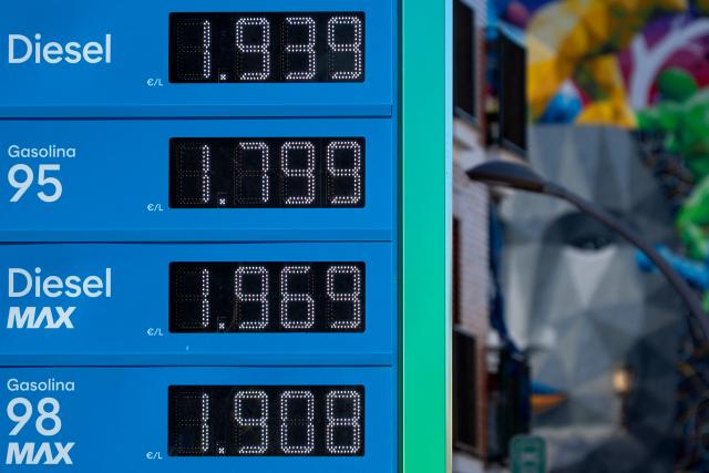 (FILES) The prices of unleaded petrol and diesel per litre are displayed at a gas station in Ronda, near Malaga on March 11, 2026. Spain and four other European Union nations have called for a tax on windfall profits of energy companies in response to rising fuel prices due to the Middle East war, Spanish Economy Minister said on April 4, 2026. (Photo by JORGE GUERRERO / AFP)