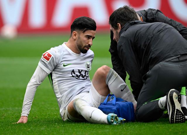 Wolfsburg's Algerian forward #09 Mohammed Amoura sits on the pitch during the German first division Bundesliga football match between Bayer leverkusen and VfL Wolfsburg in Leverkusen on April 4, 2026. (Photo by INA FASSBENDER / AFP) / DFL REGULATIONS PROHIBIT ANY USE OF PHOTOGRAPHS AS IMAGE SEQUENCES AND/OR QUASI-VIDEO