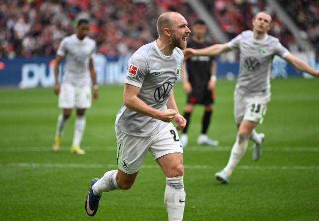 Wolfsburg's Danish midfielder #24 Christian Eriksen (C) celebrates scoring a penalty during the German first division Bundesliga football match between Bayer leverkusen and VfL Wolfsburg in Leverkusen on April 4, 2026. (Photo by INA FASSBENDER / AFP) / DFL REGULATIONS PROHIBIT ANY USE OF PHOTOGRAPHS AS IMAGE SEQUENCES AND/OR QUASI-VIDEO