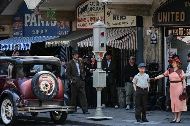 Chilean actor Pedro Pascal (C) performs for a scene of his new movie, "De Noche", which is being shot on a street of the historic center of Mexico City on April 3, 2026. (Photo by Yuri CORTEZ / AFP)