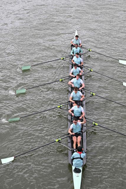 Cambridge boat, (bottom to top) Cox, Sammy Houdagui, Freddy Breuer, Will Klipstine, Lexi McClean, Gabriel Obholzer, Patrick Wild, Kyle Fram, French president, Noam Mouelle, and Simon Hatcher celebrate at the finish of the 171th men's boat race between Oxford University and Cambridge University on the River Thames in London on April 4, 2026. (Photo by JUSTIN TALLIS / AFP)