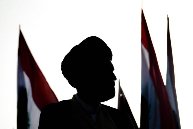 TOPSHOT - A Shia Muslim cleric looks on during a demonstration in solidarity with Iran and denouncing the US-Israeli war against it, in Iraq's southern city of Basra on April 4, 2026. Iraq, long a proxy battleground between the United States and Iran, was quickly dragged into the Middle East war triggered by US and Israeli strikes on Iran on February 28. (Photo by Hussein FALEH / AFP)