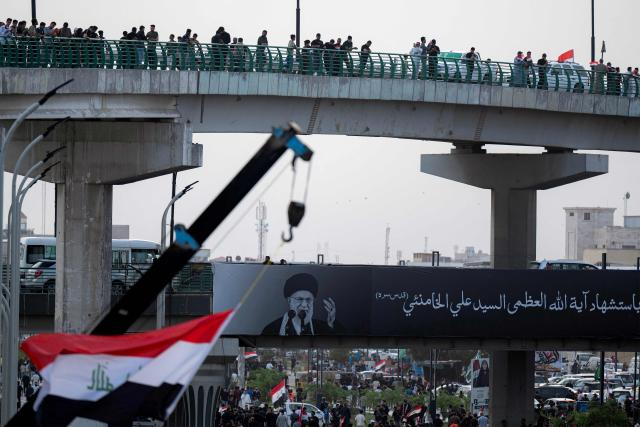 People gather for a demonstration in solidarity with Iran and denouncing the US-Israeli war against it, in Iraq's southern city of Basra on April 4, 2026. Iraq, long a proxy battleground between the United States and Iran, was quickly dragged into the Middle East war triggered by US and Israeli strikes on Iran on February 28. (Photo by Hussein FALEH / AFP)