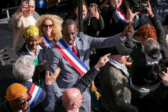 Saint-Denis Mayor Bally Bagayoko (C) gestures during a rally against racism that he convened, in Saint-Denis, on the outskirts of Paris, on April 4, 2026. "We want lots of Black mayors to fight the brown plague": several thousand people gathered to protest against racism on April 4, 2026 in Saint-Denis, following a call from the new LFI mayor, Bally Bagayoko, who, since his election, has been at the centre of a debate on racial discrimination that has now taken on national significance. (Photo by Thomas SAMSON / AFP)
