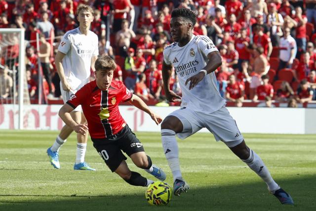 Real Madrid's French midfielder #14 Aurelien Tchouameni (R) fights for the ball with Real Mallorca’s Spanish forward #20 Pablo Torre during the Spanish league football match between RCD Mallorca and Real Madrid CF at Mallorca Son Moix Stadium in Palma de Mallorca on April 4, 2026. (Photo by JAIME REINA / AFP)