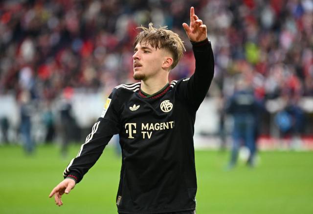Bayern Munich's German midfielder #42 Lennart Karl celebrates after the German first division Bundesliga football match between SC Freiburg and FC Bayern Munich in Freiburg, southern Germany on April 4, 2026. (Photo by Silas STEIN / AFP) / DFL REGULATIONS PROHIBIT ANY USE OF PHOTOGRAPHS AS IMAGE SEQUENCES AND/OR QUASI-VIDEO