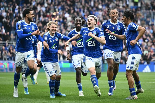 Strasbourg's French midfielder #29 Samir El Mourabet (C) celebrates scoring his team's third goal during the French L1 football match between RC Strasbourg Alsace and OGC Nice at the Stade de la Meinau in Strasbourg, eastern France, on April 4, 2026. (Photo by SEBASTIEN BOZON / AFP)
