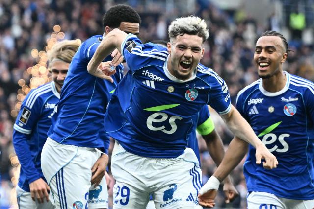 Strasbourg's French midfielder #29 Samir El Mourabet (C) celebrates scoring his team's third goal during the French L1 football match between RC Strasbourg Alsace and OGC Nice at the Stade de la Meinau in Strasbourg, eastern France, on April 4, 2026. (Photo by SEBASTIEN BOZON / AFP)