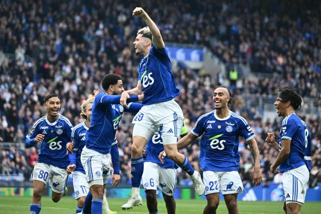 Strasbourg's French midfielder #29 Samir El Mourabet (C) celebrates scoring his team's third goal during the French L1 football match between RC Strasbourg Alsace and OGC Nice at the Stade de la Meinau in Strasbourg, eastern France, on April 4, 2026. (Photo by SEBASTIEN BOZON / AFP)