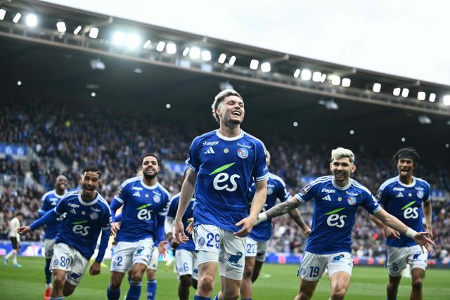 Strasbourg's French midfielder #29 Samir El Mourabet (C) celebrates scoring his team's third goal during the French L1 football match between RC Strasbourg Alsace and OGC Nice at the Stade de la Meinau in Strasbourg, eastern France, on April 4, 2026. (Photo by SEBASTIEN BOZON / AFP)