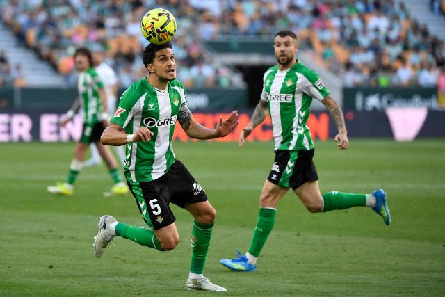 Real Betis' Spanish defender #05 Marc Bartra heads the ball during the Spanish league football match between Real Betis and RCD Espanyol at Benito Villamarin Stadium in Seville on April 4, 2026. (Photo by CRISTINA QUICLER / AFP)