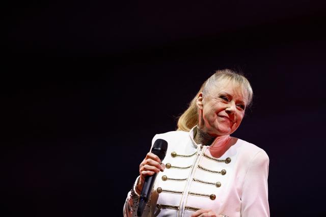 Former French TV host and singer Frederique Hoschede, also known as Dorothee, performs on stage at the Palais des Congres concert hall in Paris on April 4, 2026. (Photo by Kenzo TRIBOUILLARD / AFP)