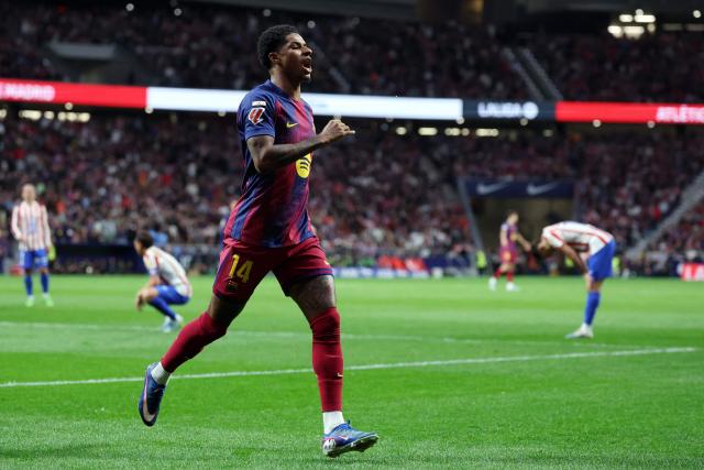 Barcelona's English forward #14 Marcus Rashford celebrates scoring his team's first goal during the Spanish league football match between Club Atletico de Madrid and FC Barcelona at Metropolitano Stadium in Madrid on April 4, 2026. (Photo by Pierre-Philippe MARCOU / AFP)