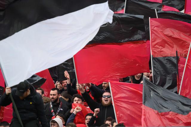 Rennes' supporters cheer their team on from the stands during the French L1 football match between Stade Brestois 23 and Stade Rennais at the Francis-Le-Ble stadium in Brest, western France, on April 4, 2026. (Photo by Loic VENANCE / AFP)