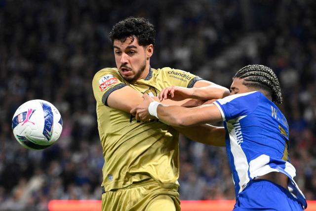 FC Famalicão's Portuguese defender #05 Rafa (L) and FC Porto's Brazilian forward #07 William Gomes fight for the ball during the Portuguese League football match between FC Porto and FC Famalicao at Dragao stadium in Porto on April 4, 2026. (Photo by Miguel RIOPA / AFP)