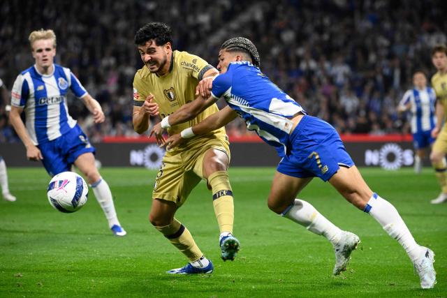 FC Famalicão's Portuguese defender #05 Rafa (L) and FC Porto's Brazilian forward #07 William Gomes fight for the ball during the Portuguese League football match between FC Porto and FC Famalicao at Dragao stadium in Porto on April 4, 2026. (Photo by Miguel RIOPA / AFP)