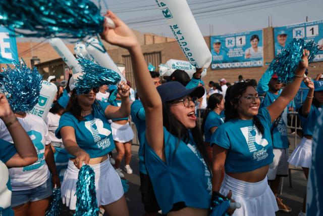 Supporters of Peru’s presidential candidate Rafael Lopez Aliaga, of the Renovacion Popular party, shout slogans before a meeting in Lima on April 4, 2026. Peru will hold presidential elections on April 12. (Photo by Connie FRANCE / AFP)