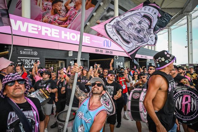 Fans of the Vice City supporters’ group of the Inter Miami soccer team celebrate during the ribbon-cutting ceremony at the newly opened Nu Stadium in Miami, Florida on April 4, 2026. (Photo by Giorgio VIERA / AFP)