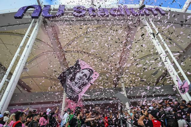 Fans of the Vice City supporters’ group of the Inter Miami soccer team celebrate during the ribbon-cutting ceremony at the newly opened Nu Stadium in Miami, Florida on April 4, 2026. (Photo by Giorgio VIERA / AFP)