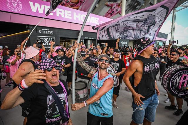 Fans of the Vice City supporters’ group of the Inter Miami soccer team celebrate during the ribbon-cutting ceremony at the newly opened Nu Stadium in Miami, Florida on April 4, 2026. (Photo by Giorgio VIERA / AFP)