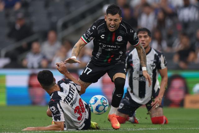 Monterrey's Argentine midfielder #30 Jorge Rodriguez and San Luis' Uruguayan forward #17 Anderson Duarte fight for the ball during the Liga MX Clausura football match between Monterrey and San Luis at BBVA stadium in Guadalupe, Nuevo Leon state, Mexico, on April 4, 2026. (Photo by Julio Cesar AGUILAR / AFP)