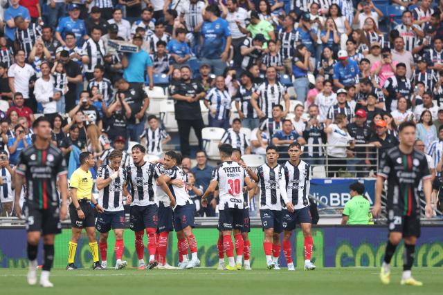 Monterrey's Montenegrin forward #20 Uros Djurdevic celebrates with teammates after scoring his team's first goal during the Liga MX Clausura football match between Monterrey and San Luis at BBVA stadium in Guadalupe, Nuevo Leon state, Mexico, on April 4, 2026. (Photo by Julio Cesar AGUILAR / AFP)