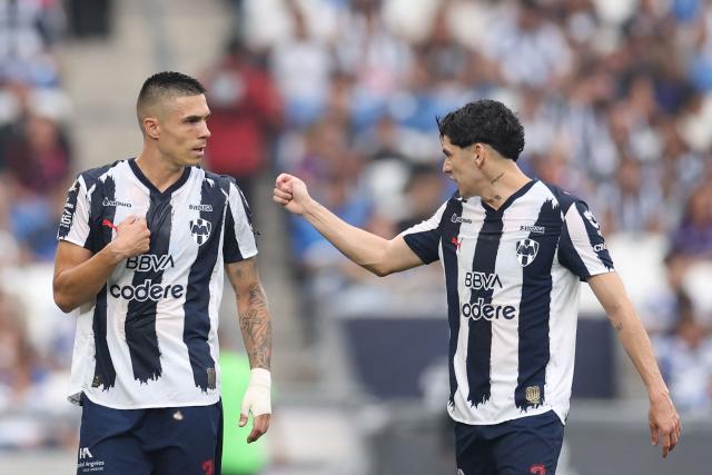Monterrey's Montenegrin forward #20 Uros Djurdevic (L) celebrates after scoring his team's first goal with teammate defender #03 Gerardo Arteaga (R) during the Liga MX Clausura football match between Monterrey and San Luis at BBVA stadium in Guadalupe, Nuevo Leon state, Mexico, on April 4, 2026. (Photo by Julio Cesar AGUILAR / AFP)