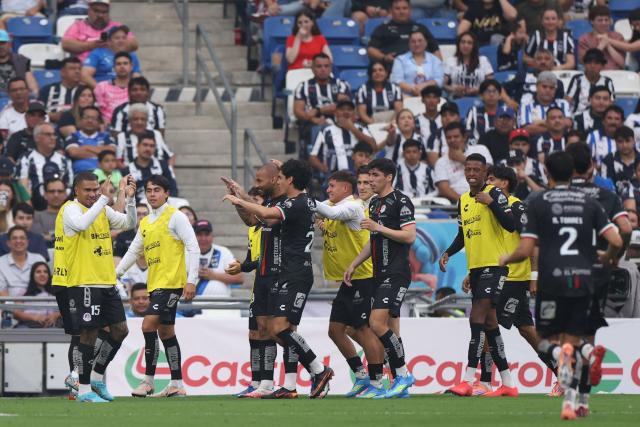 San Luis' Brazilian forward #09 Joao Pedro (3nd L) celebrates scoring his team's first goal during the Liga MX Clausura football match between Monterrey and San Luis at BBVA stadium in Guadalupe, Nuevo Leon state, Mexico, on April 4, 2026. (Photo by Julio Cesar AGUILAR / AFP)