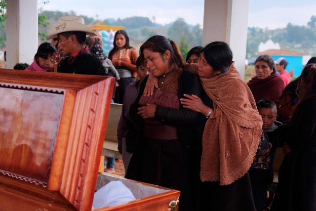Relatives and friends cry watching the coffin of Royer Perez Jimenez, a 19-year-old Mexican migrant who was found dead in a US detention center, during his funeral in the Tzotzil indigenous community of San Juan Chamula, Chiapas state, Mexico on April 4, 2026. Royer Perez Jimenez was found dead in a Florida detention center operated by US Immigration and Customs Enforcement (ICE) on March 16, 2026. ICE and the Mexican government gave the presumed cause of death as suicide. (Photo by Luis AGUILAR / AFP)