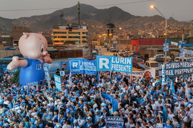 This aerial view shows supporters of Peru's presidential candidate Rafael Lopez Aliaga for the Renovacion Popular party attending a campaign rally in Lima on April 4, 2026. Peru will hold presidential elections on April 12. (Photo by Connie FRANCE / AFP)