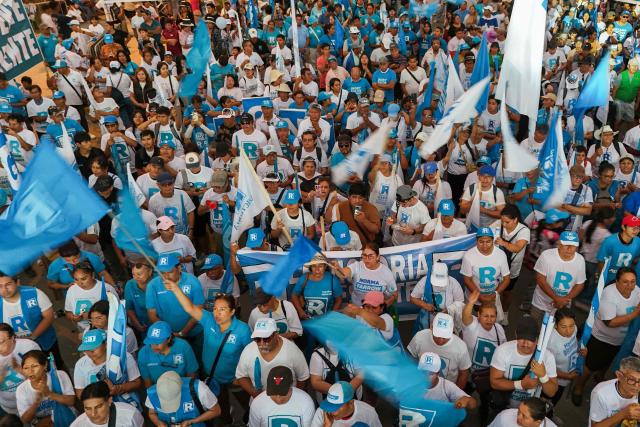 This aerial view shows supporters of Peru's presidential candidate Rafael Lopez Aliaga for the Renovacion Popular party attending a campaign rally in Lima on April 4, 2026. Peru will hold presidential elections on April 12. (Photo by Connie FRANCE / AFP)