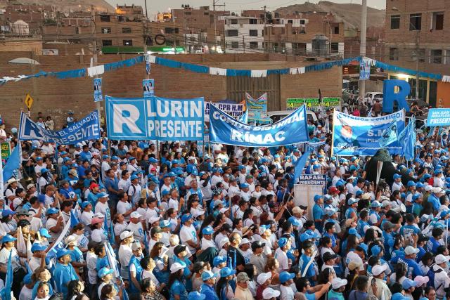 This aerial view shows supporters of Peru's presidential candidate Rafael Lopez Aliaga for the Renovacion Popular party attending a campaign rally in Lima on April 4, 2026. Peru will hold presidential elections on April 12. (Photo by Connie FRANCE / AFP)