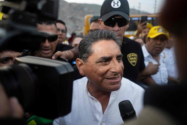 Peru's presidential candidate Carlos Alvarez for the Pais Para Todos party arrives at a campaign rally in San Juan de Lurigancho, on the outskirts of Lima, on April 4, 2026. Peru will hold presidential elections on April 12. (Photo by ERNESTO BENAVIDES / AFP)