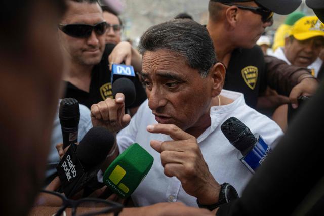 Peru's presidential candidate Carlos Alvarez for the Pais Para Todos party speaks to the media during a campaign rally in San Juan de Lurigancho, on the outskirts of Lima, on April 4, 2026. Peru will hold presidential elections on April 12. (Photo by ERNESTO BENAVIDES / AFP)