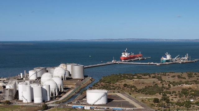 An aerial photo taken on April 4, 2026 shows the Geelong Oil Refinery, one of two oil refineries remaining in Australia. The refinery can process up to 120,000 barrels of oil per day, manufacturing petrol, diesel, LPG, jet fuel and avgas. (Photo by William WEST / AFP)