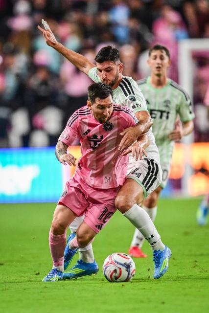 Inter Miami's Argentine forward #10 Lionel Messi is challenged by Austin's Swedish midfielder #14 Besard Sabovic during a Major League Soccer (MLS) regular season football match between Inter Miami CF and Austin FC at the newly inaugurated NU Stadium in Miami, Florida, on April 4, 2026. (Photo by Giorgio VIERA / AFP)