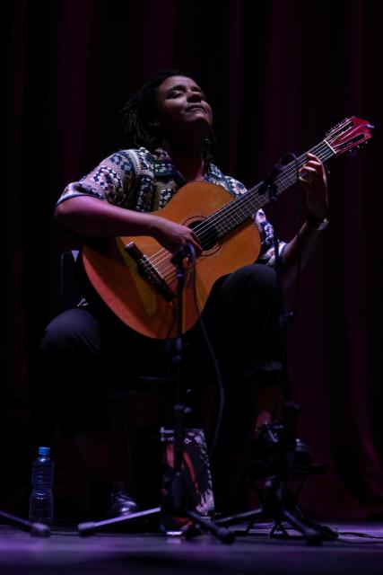 Brazilian guitarist Gabriele Leite performs on stage during the Queremos music festival at the Carlos Gomes theatre in Rio de Janeiro, Brazil on April 4, 2026. (Photo by Pablo PORCIUNCULA / AFP)