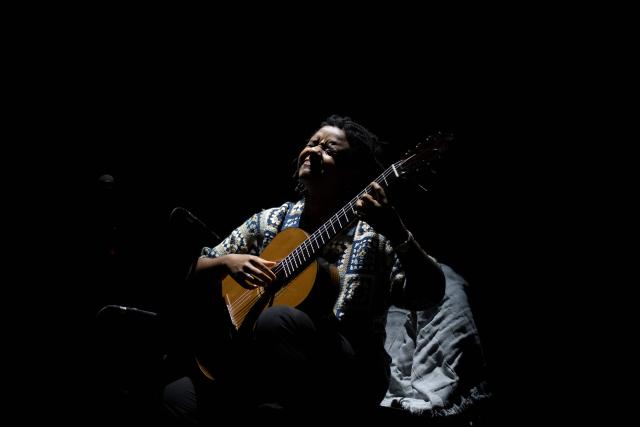 Brazilian guitarist Gabriele Leite performs on stage during the Queremos music festival at the Carlos Gomes theatre in Rio de Janeiro, Brazil on April 4, 2026. (Photo by Pablo PORCIUNCULA / AFP)