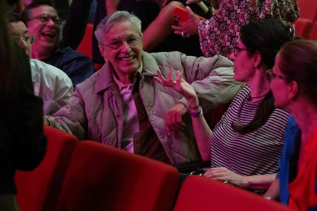 Brazilian songwriter Caetano Veloso (L) and his wife Paula Lavigne (2nd-R) talk after the performance of their son Zeca Veloso (unseen) during the Queremos music festival at the Carlos Gomes theatre in Rio de Janeiro, Brazil on April 4, 2026. (Photo by Pablo PORCIUNCULA / AFP)